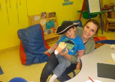 Preschool teacher and child at Little Learners of Westchester